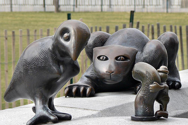 Tom Otterness sculpture: Cat stalks bird stalking worm