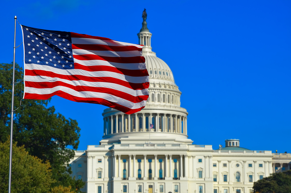 US flag and Capitol Building