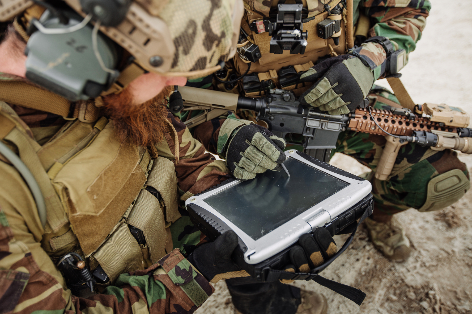 Army personnel working on technology